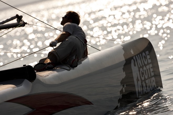 Trimmer Nils Frei sail tuning onboard Alinghi on Day 1 of Act 7, Nice  - extreme Sailing Series 2011 &copy; Lloyd Images http://lloydimagesgallery.photoshelter.com/